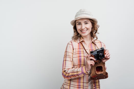 Girl with camera, travel, traveler. Isolated on a white background. photo