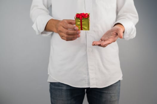 Hand holding gift box, new year gift box, Christmas gift box ,copy space. Christmas, hew year, birthday concept. photo
