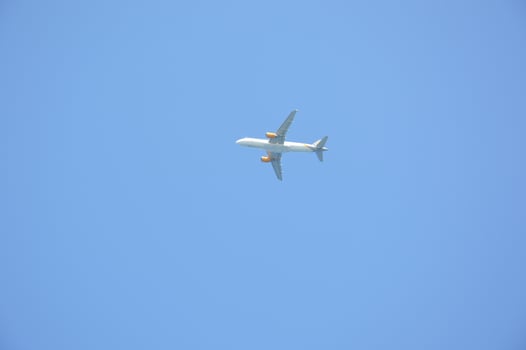 Takeoff of a passenger plane against the blue sky photo