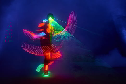Laser show performance, dancers in led suits with LED lamp, very beautiful night club performance, party photo