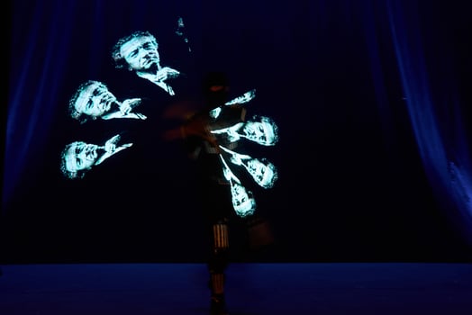 Laser show performance, dancers in led suits with LED lamp, very beautiful night club performance, party photo