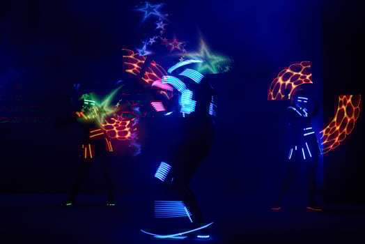 Laser show performance, dancers in led suits with LED lamp, very beautiful night club performance, party photo