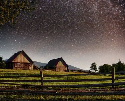 Fantastic starry sky stacks and traditional mountain villages. Carpathians, Ukraine photo