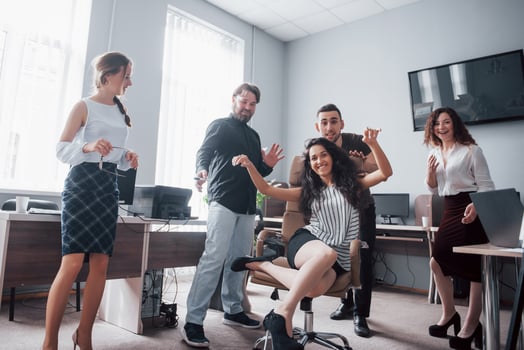 Happy young colleagues smile and have fun at the creative office. photo