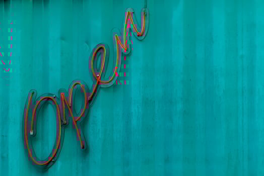 Open letter neon sign on the blue steel wall in Brazil photo