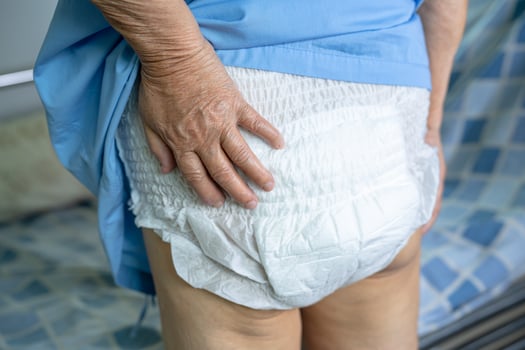 Asian senior or elderly old lady woman patient wearing incontinence diaper in nursing hospital ward, healthy strong medical concept. photo