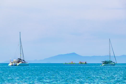 Boats tropical island Koh Phayam Ao Khao Kwai Beach Thailand photo