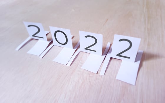 2022 perspective paper cut on wood background photo