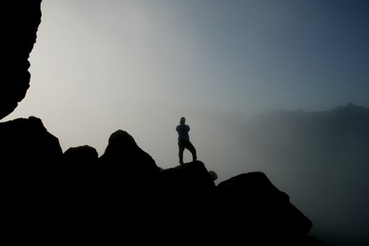 silhouette person on the hill photo