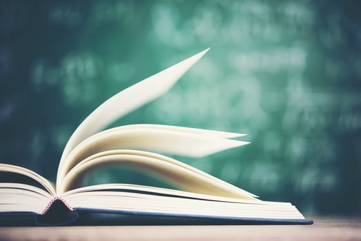 Open book with green board background photo
