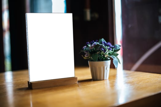Blank white menu on table at restaurant photo