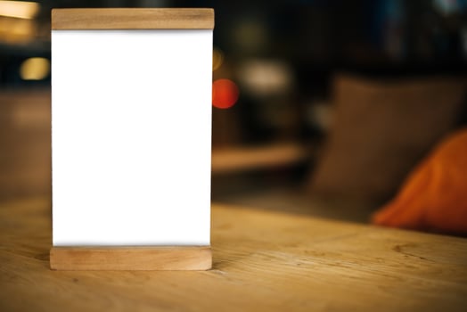 Blank white menu on table at restaurant photo