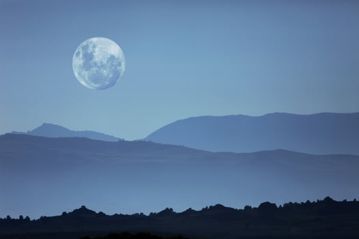 Ghostly Mountain Silhouettes and Moon photo