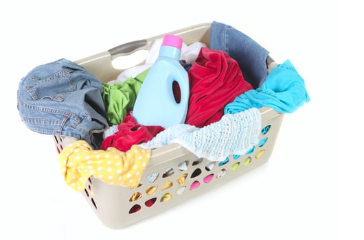 Laundry Basket Full of Dirty Clothes and Softener photo