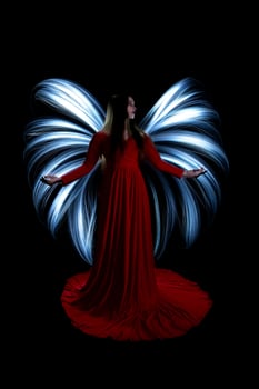 Model in Studio Light Painted on Black Background photo
