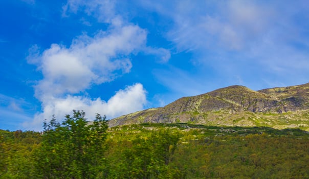 Incredible norwegian landscape colorful mountains clouds forests Jotunheimen Norway photo