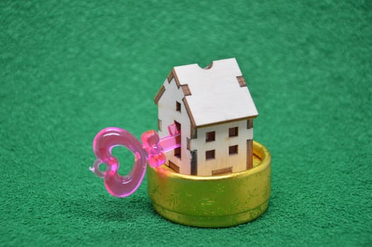 Receiving keys to his apartment building on a background of green grass photo