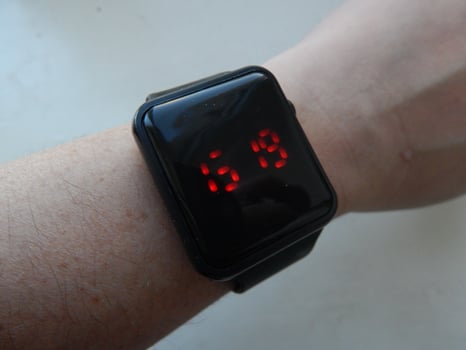 Wrist electronic smart watch is worn on the male hand photo
