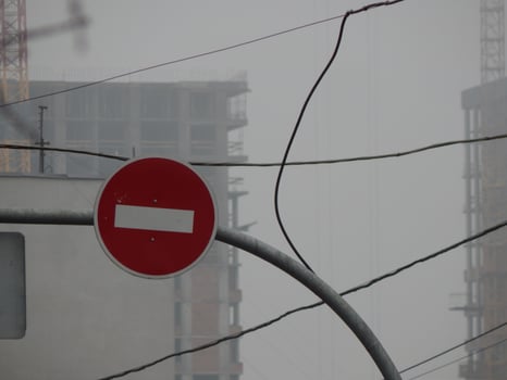 Road signs indicating the direction of movement of cars and pedestrians photo