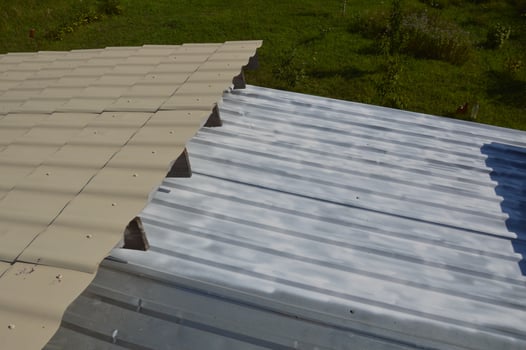Roof painting with enamel paint from an aerosol can photo