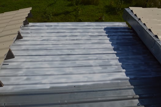 Roof painting with enamel paint from an aerosol can photo