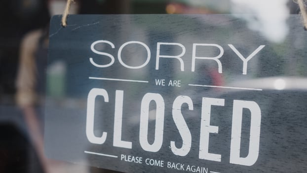 Sorry we're closed vintage black and white retro sign on a coffee glass door cafe after coronavirus lockdown quarantine. Owner small business, food and drink, business financial crisis concept. photo
