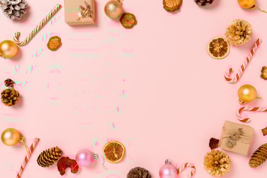 Minimal creative flat lay of christmas traditional composition and new year holiday season. Top view winter christmas decorations on pink background with blank space for text. Copy space photography. photo