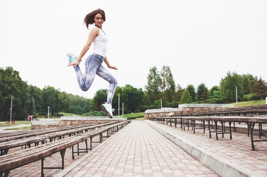 Woman doing parkour in the city on a sunny day photo