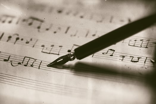 Old musical score with fountain pen photo