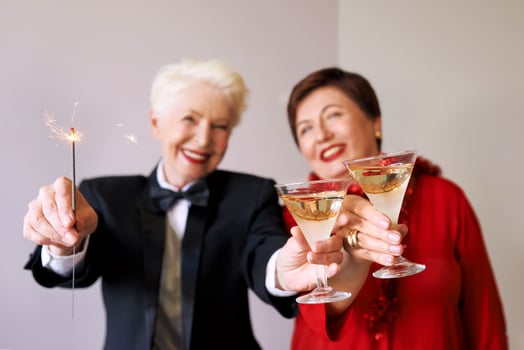 Two beautiful stylish mature senior women celebrating new year. Fun, party, style, celebration concept photo