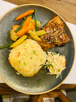 a plate of fried rice and chicken with decoration photo