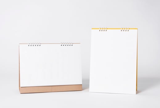 Blank paper spiral calendar for mockup template advertising and branding background. photo