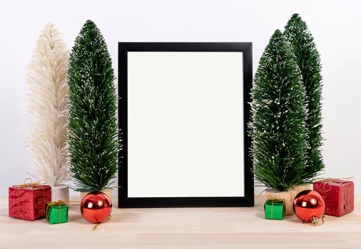 Christmas holiday greeting frame design mockup with decoration on wood table. photo