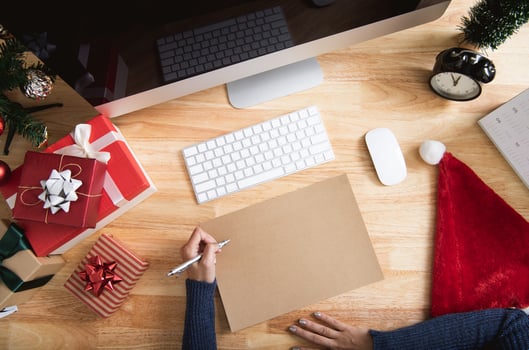 Happy new year holiday greeting paper card design mockup with decoration on wood table. photo