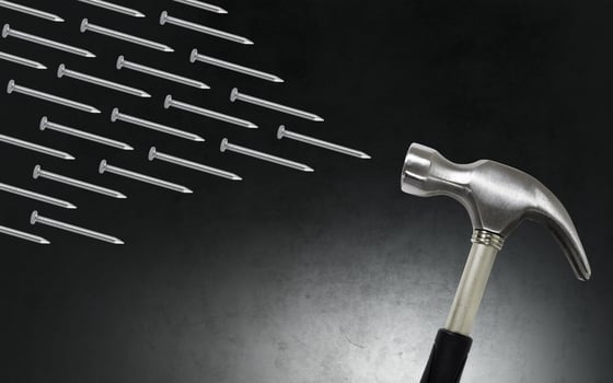 Hammer and nails on dark background photo