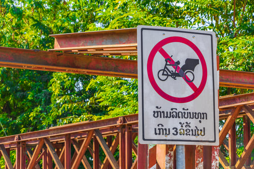 Forbidden for rickshaw and tuk tuk on old French Bridge. photo