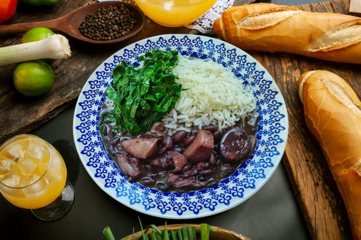 Traditional Brazilian feijoada with cabbage and rice photo