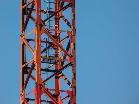 Main girder of a tower crane against cloudy sky background. photo