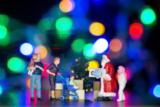 Miniature people, Santa claus delivery gift box to kids photo