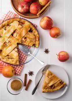 Top view of homemade apple pie on wooden table photo