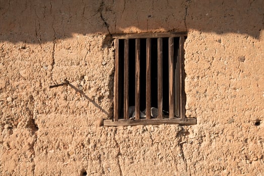 Old windows on all kinds of walls photo