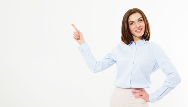 Portrait of young beautiful smile business woman pointing at white background photo