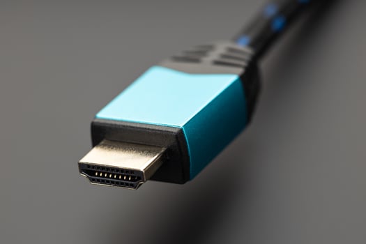 Close up of a professional HDMI plug on black background photo
