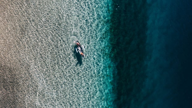 Canoe in clear water photo