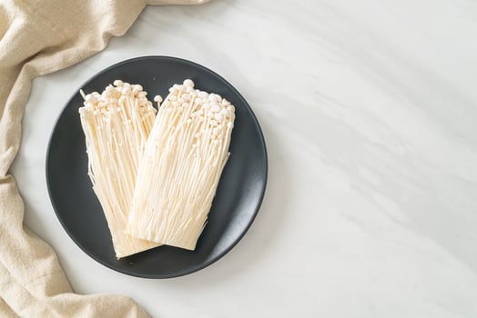 fresh enoki mushroom or golden needle mushrooms photo
