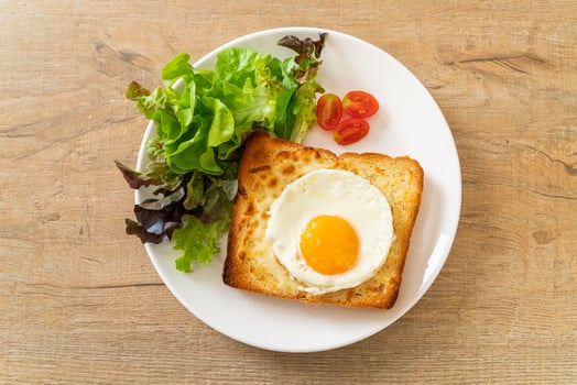 bread toasted with cheese and fried egg photo