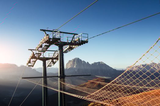 Extreme tourism. Cableway standing on the hills in Seceda dolomites photo