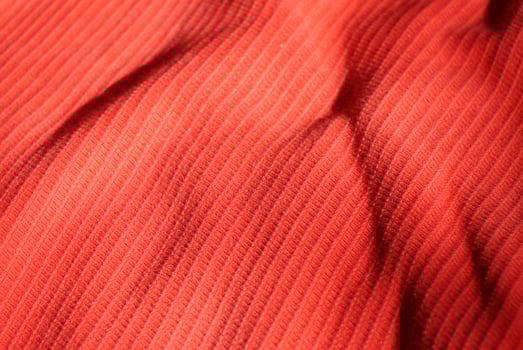 Red material background. Vivid red cloth background. photo