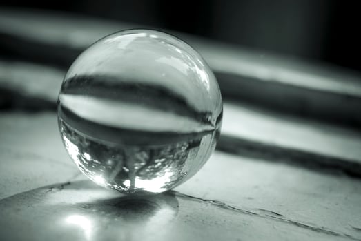 Monochrome image of a lens ball on an old window sill photo