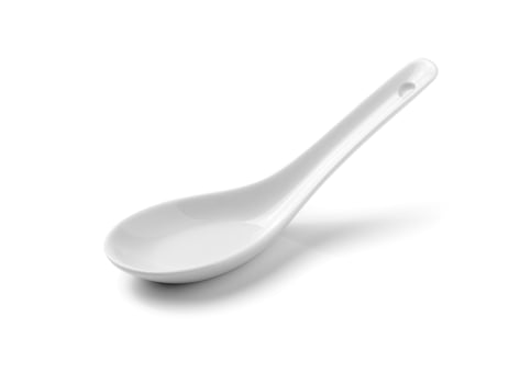 White Chinese soup spoon isolated on white background photo